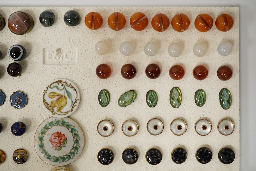 A collection of early 20th century buttons, including agate, ceramic and enamel, largest 43mm. Condition - good
